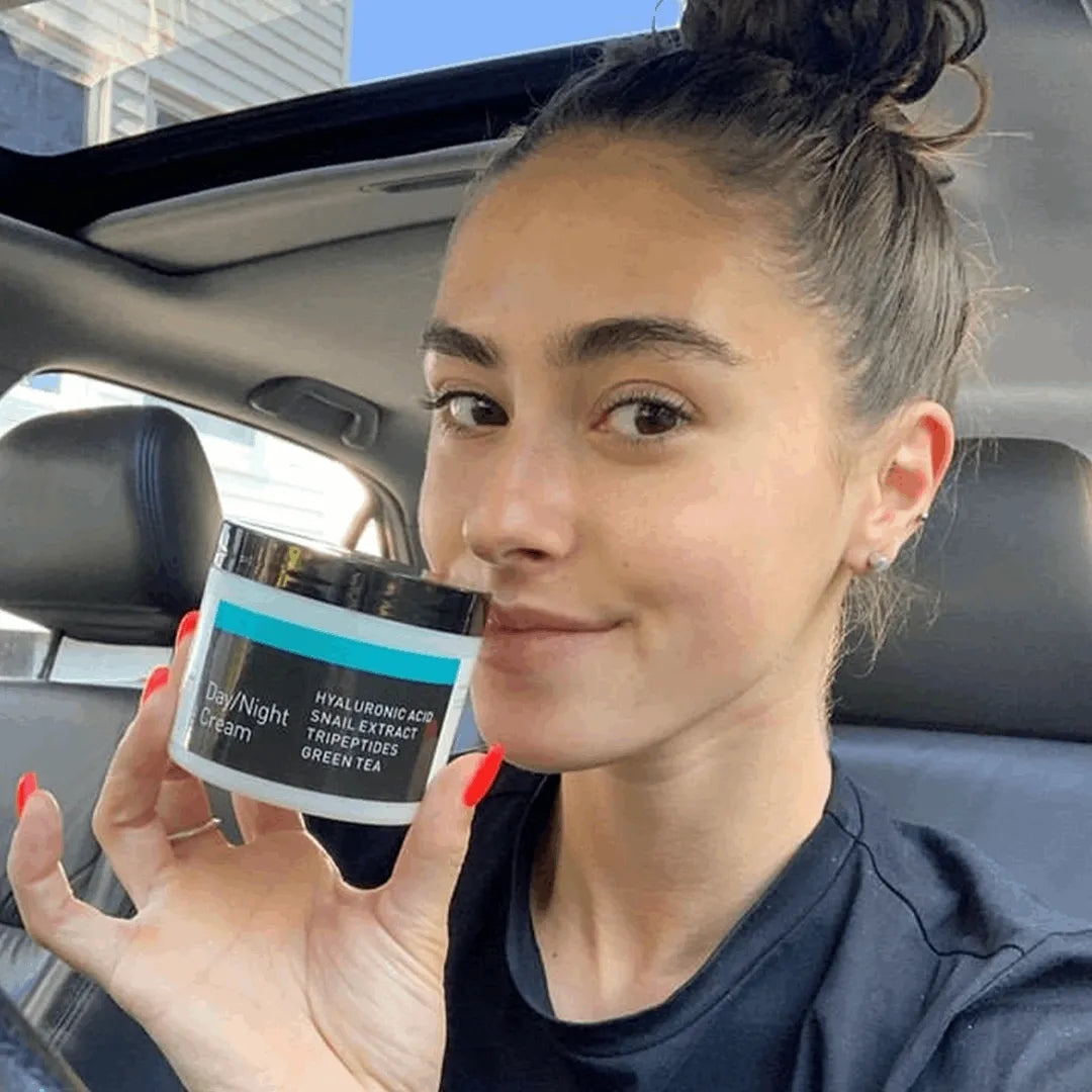 Day Night Cream with Snail Extract Woman holding YEOUTH Day Night Cream with hyaluronic acid, snail extract, tripeptides, and green tea for anti-aging skincare and intense hydration in car