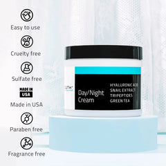 Day Night Cream with Snail Extract YEOUTH best moisturizer for mature skin jar on blue stand with icons showing cruelty free, paraben free, and made in USA.
