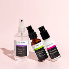 YEOUTH skincare set  Facial Toner, Hyaluronic Acid Serum, and Anti-Aging Moisturizer displayed on a light pink background.